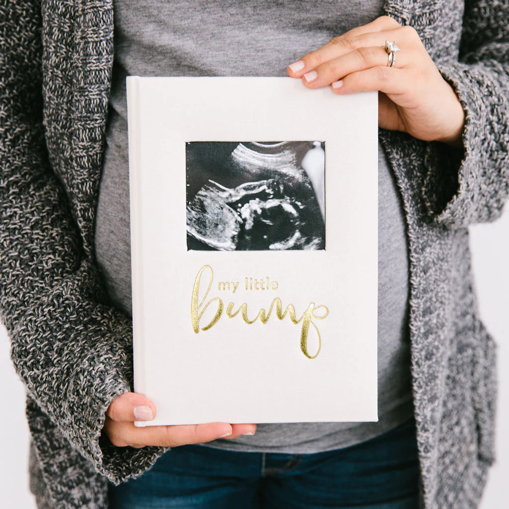 Record every special moment of your pregnancy with Pearhead’s pregnancy journal Ideal for gifting at baby showers With 50+ pages and a 4” x 5” photo insert, "my little bump” in gold foil adds a playful touch to this cloth and paper journal Measuring 6.5” W x 9.2” H x .6” D, it makes the perfect keepsake Packaging dimensions: 6.5” W x 9.2” H x .6” D