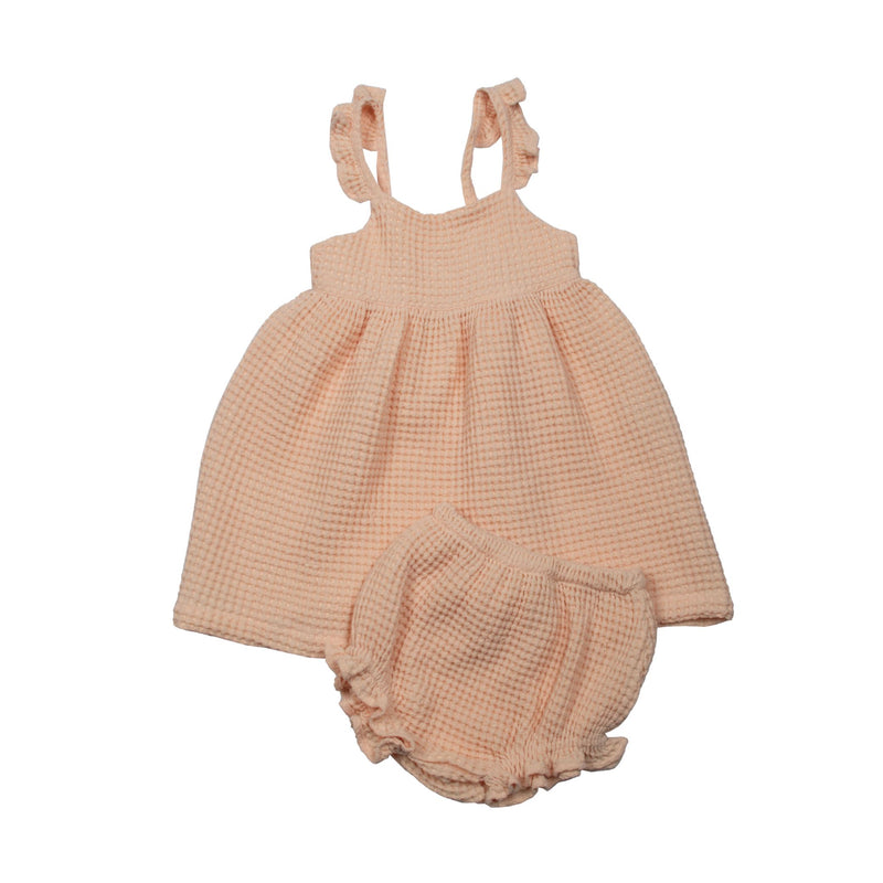 Suuky premium waffle dress with frill and bloomer for baby. Perfect for beach vacation. baby girl summer outfit for wedding. Ships to United States, duty free. Pinterest Inspired outfit for girls. Modern vintage outfit for baby girls. Frill Bloomer and frill dress.