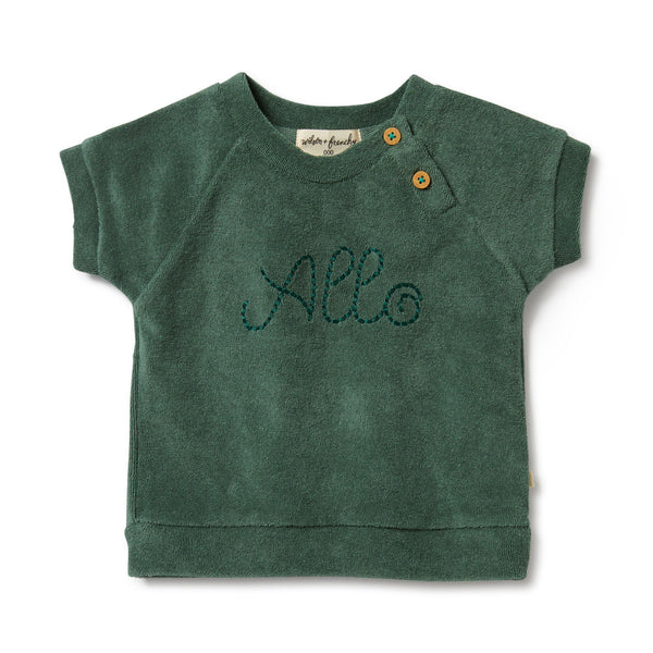 Elevate your little one's wardrobe with the adorable 'Allo' Baby Terry Cloth Green Tee from Wilson & Frenchy. Crafted with soft terry cloth fabric, this charming tee features the word "allo" embroidered on the front, adding a playful touch to any outfit. Imported from Australia, this high-quality tee is perfect for everyday wear or special occasions. Enjoy free shipping to Canada and the US on orders over $100, with standard shipping rates of $6 CAD / $4.30 USD for orders below the threshold.