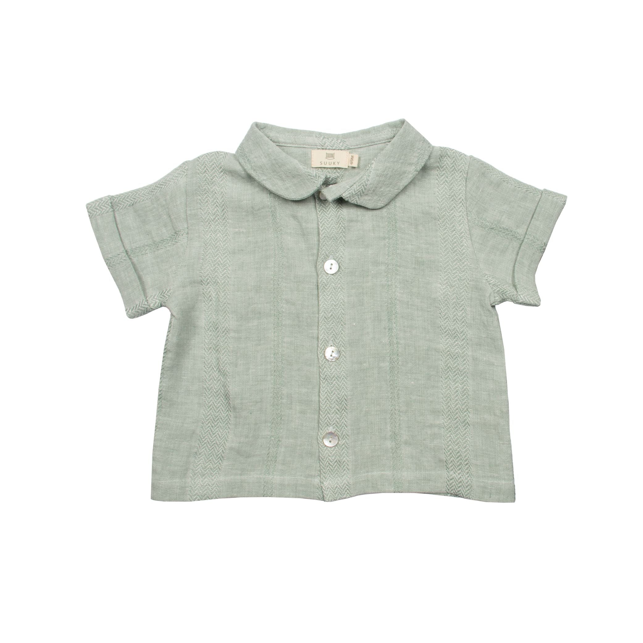 Textured Green Mint Linen polo top and shorts for baby. Gender Neutral outfit for baby for wedding.. made in portugal. Suuky Porto certified products. Beautiful for a garden wedding. Baby inspired outfit for holiday in Florida, Boca Raton. Ships to Canada and United States of America, Duty Free. Organic, natural Materials. First Birthday Gift for baby girl. Sustainable luxury for baby & toddler.