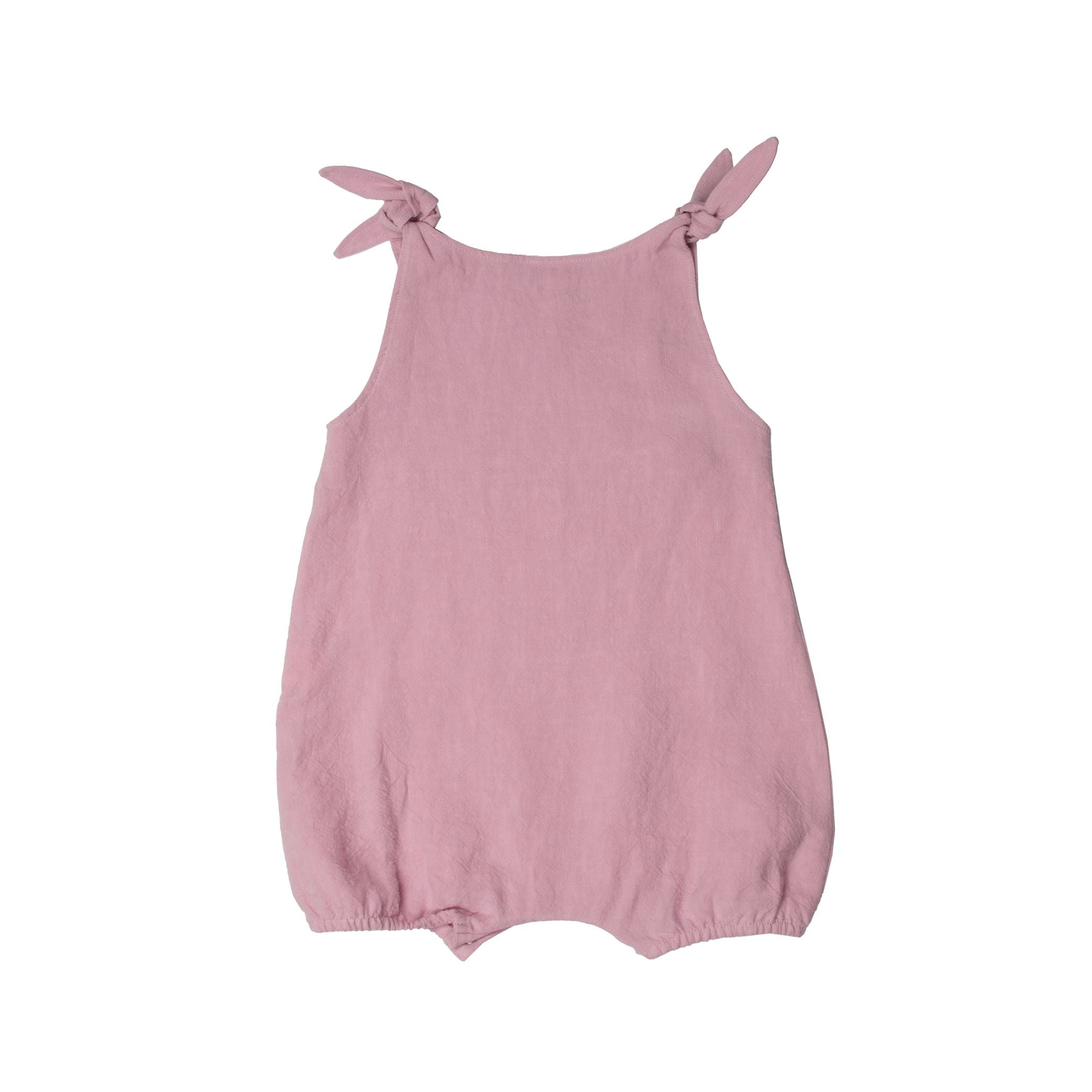 Lilac linen romper for baby girl. made in portugal. Suuky Porto certified products. Beautiful for a garden wedding. Baby inspired outfit for holiday in Florida, Boca Raton. Ships to Canada and United States of America, Duty Free. Organic, natural Materials. First Birthday Gift for baby girl. Sustainable luxury for baby & toddler.